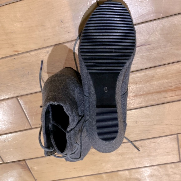 Brand new Wedge Lace-Up Booties, never worn.
Size 6. - Picture 2 of 2